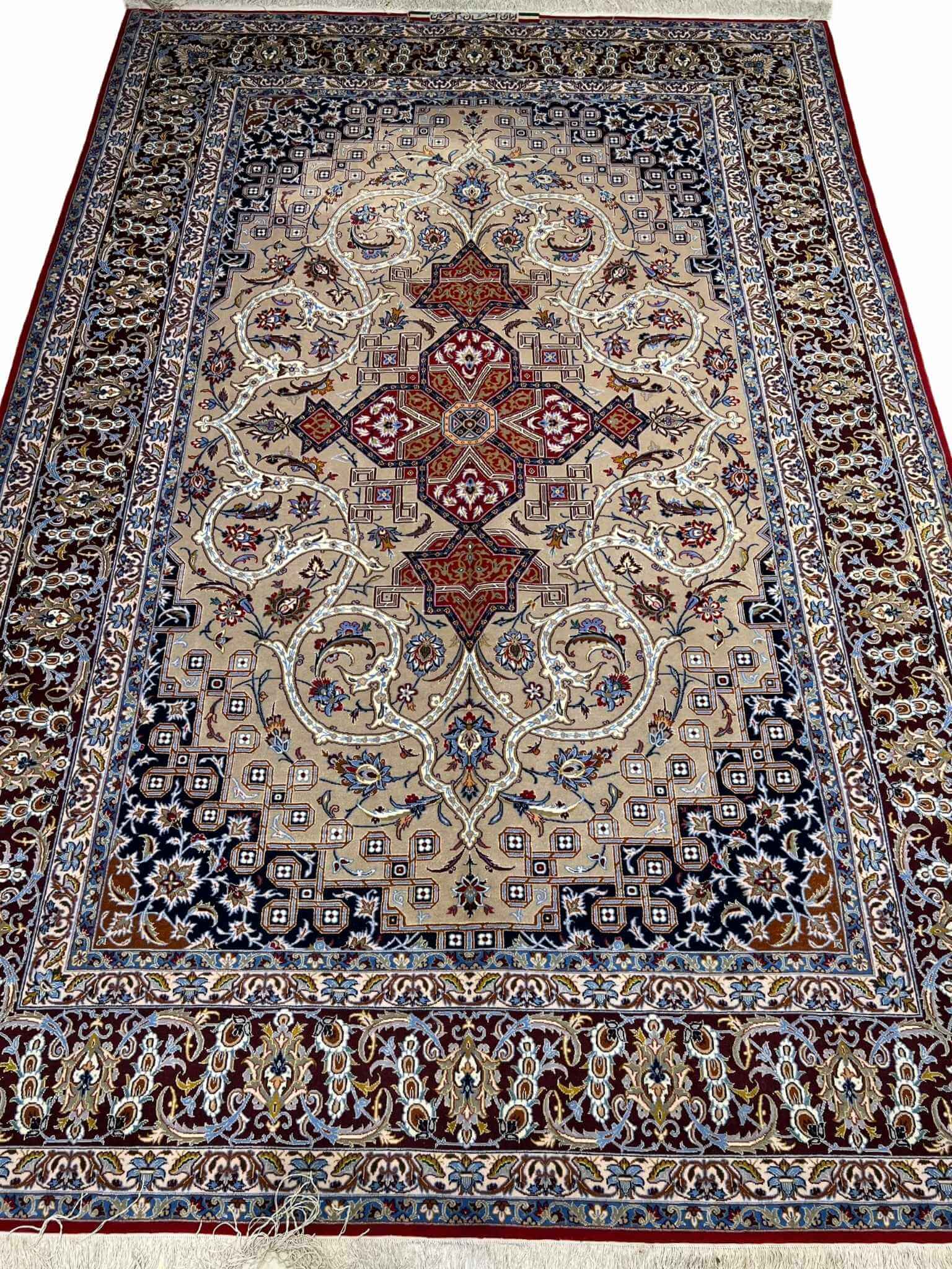 Vintage Persian Isfahan rug with medallion and geometric designs.